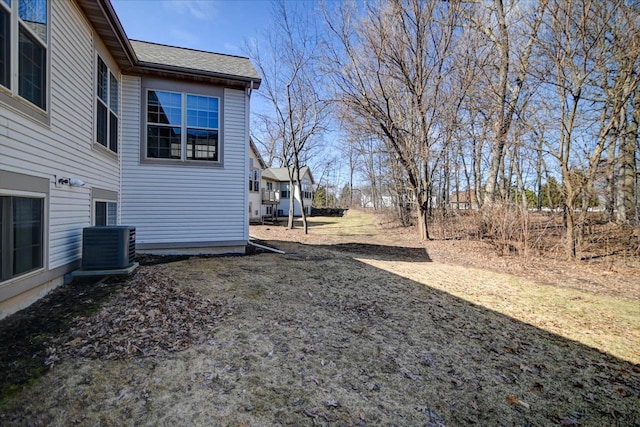 view of yard featuring central air condition unit