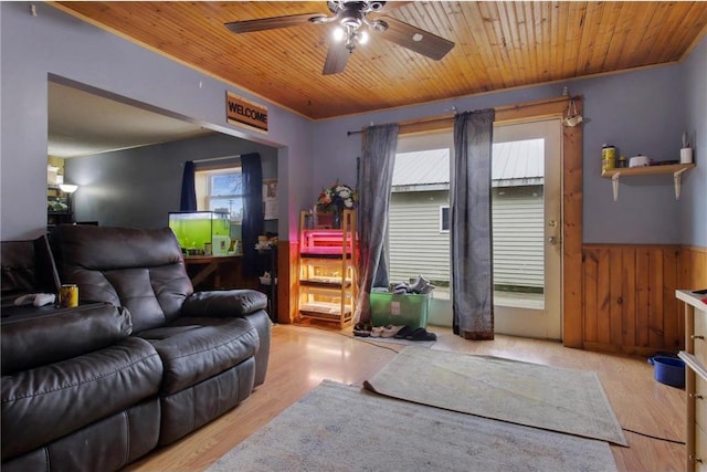905 Lewis Ave, Cameron, WI 54822 - living room featuring wooden walls, wainscoting, ceiling fan, wood finished floors, and wood ceiling