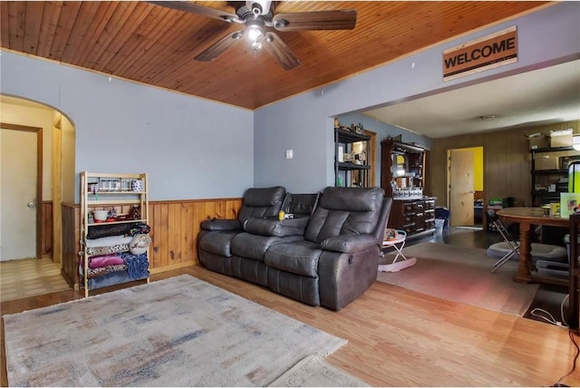 905 Lewis Ave, Cameron, WI 54822 - living area with a wainscoted wall, wood ceiling, arched walkways, and ceiling fan