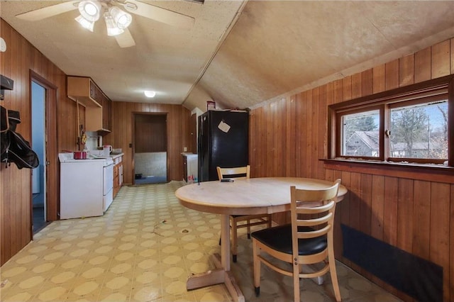 905 Lewis Ave, Cameron, WI 54822 - dining room featuring lofted ceiling, wood walls, a ceiling fan, and light floors