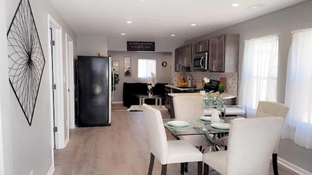 33110 Store St, Burlington, WI 53105 - dining area with baseboards, light wood-style flooring, and recessed lighting