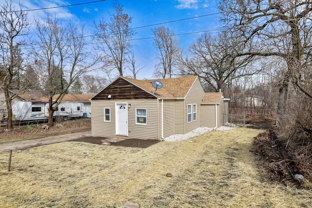 33110 Store St, Burlington, WI 53105 - view of front of home with a shingled roof and fence