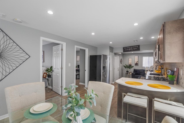 33110 Store St, Burlington, WI 53105 - dining room featuring wood finished floors, baseboards, and recessed lighting