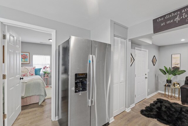 33110 Store St, Burlington, WI 53105 - kitchen featuring stainless steel refrigerator with ice dispenser, baseboards, and wood finished floors