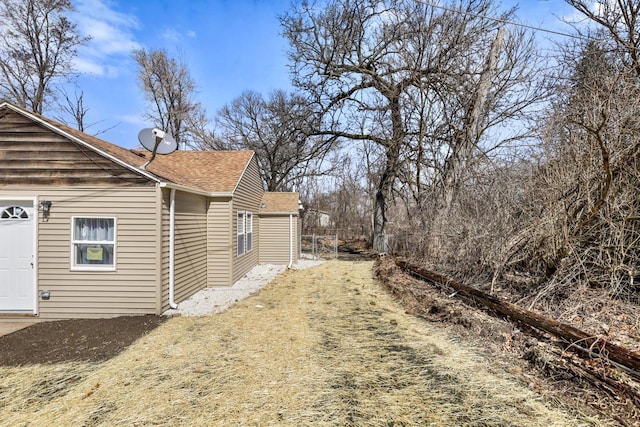 33110 Store St, Burlington, WI 53105 - view of property exterior featuring a shingled roof