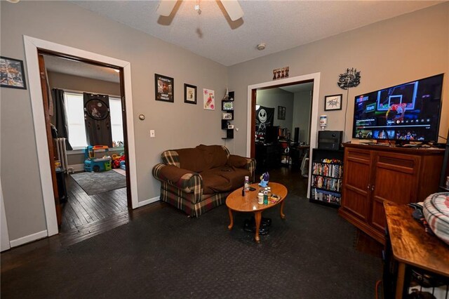 301 Summit St, Spooner, WI 54801 - living area with baseboards, wood finished floors, ceiling fan, and a textured ceiling