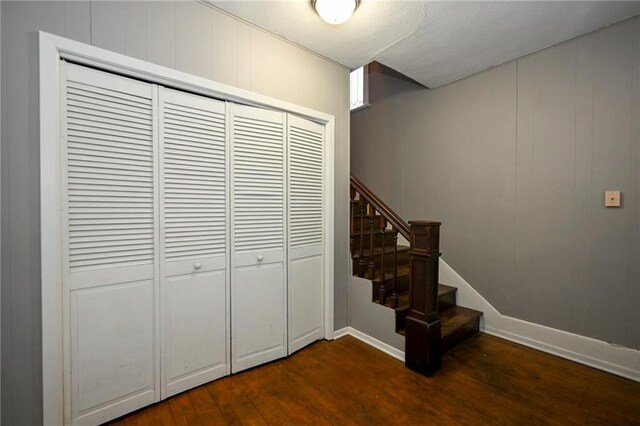 301 Summit St, Spooner, WI 54801 - staircase featuring baseboards and wood finished floors
