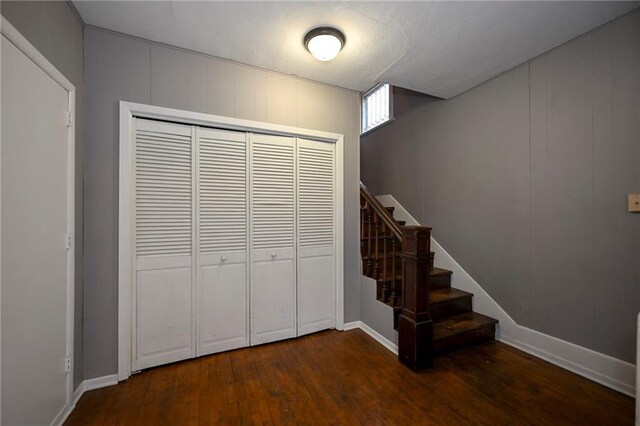 301 Summit St, Spooner, WI 54801 - stairway featuring hardwood / wood-style floors and baseboards