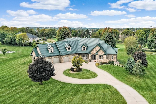 7548 Fallen Oak Dr, Verona, WI 53593 - view of front of house with metal roof, a front yard, a standing seam roof, and curved driveway