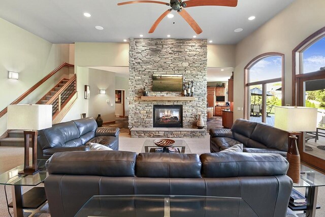 7548 Fallen Oak Dr, Verona, WI 53593 - living room with a stone fireplace, recessed lighting, stairway, and a ceiling fan