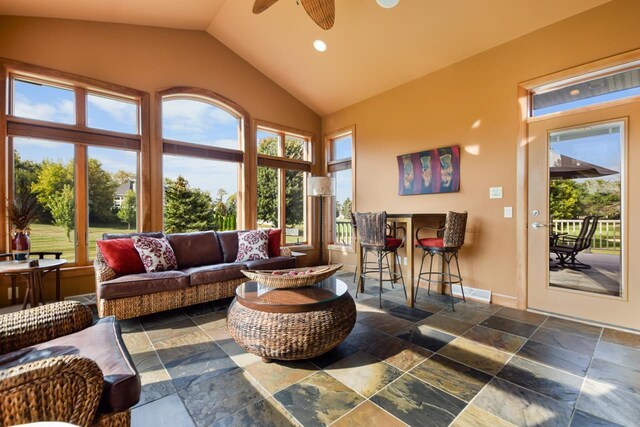 7548 Fallen Oak Dr, Verona, WI 53593 - sunroom / solarium with baseboards, high vaulted ceiling, and stone tile floors