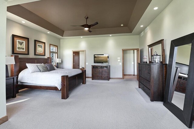 7548 Fallen Oak Dr, Verona, WI 53593 - bedroom with visible vents, baseboards, recessed lighting, a raised ceiling, and light colored carpet