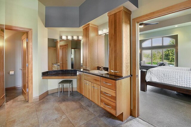 7548 Fallen Oak Dr, Verona, WI 53593 - bathroom featuring vanity, baseboards, and ensuite bathroom