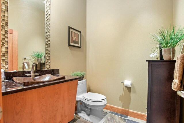 7548 Fallen Oak Dr, Verona, WI 53593 - bathroom with baseboards, toilet, and vanity