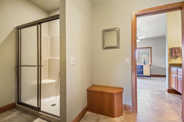 7548 Fallen Oak Dr, Verona, WI 53593 - full bath with baseboards, tile patterned floors, and a shower stall