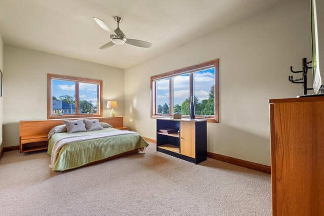 7548 Fallen Oak Dr, Verona, WI 53593 - carpeted bedroom featuring a ceiling fan and baseboards