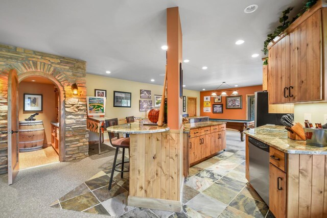 7548 Fallen Oak Dr, Verona, WI 53593 - kitchen with a breakfast bar area, dishwasher, billiards, arched walkways, and recessed lighting