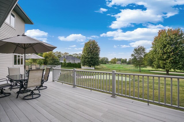 7548 Fallen Oak Dr, Verona, WI 53593 - wooden deck with a lawn and outdoor dining space