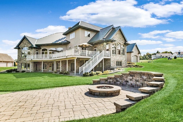7548 Fallen Oak Dr, Verona, WI 53593 - back of house featuring stone siding, a standing seam roof, and metal roof