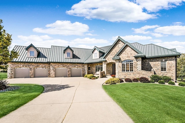 7548 Fallen Oak Dr, Verona, WI 53593 - view of front of house with metal roof, a garage, a standing seam roof, a front lawn, and driveway