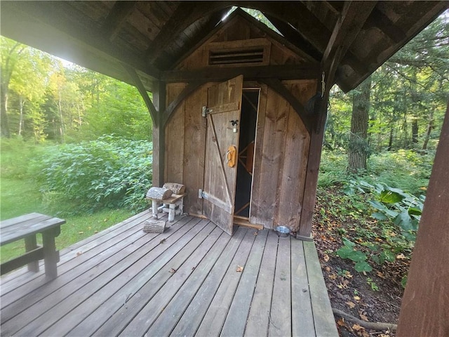 W16099 Manglos Ave, Sheldon, WI 54766 - wooden deck featuring a view of trees