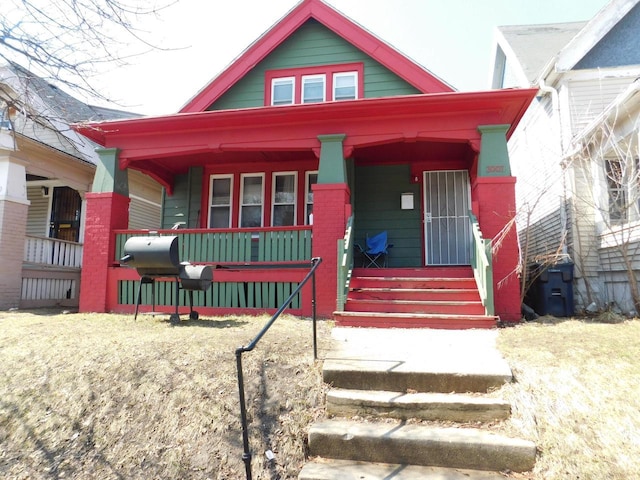 3007 N 29th St, Milwaukee, WI 53210 - view of front facade with covered porch and brick siding