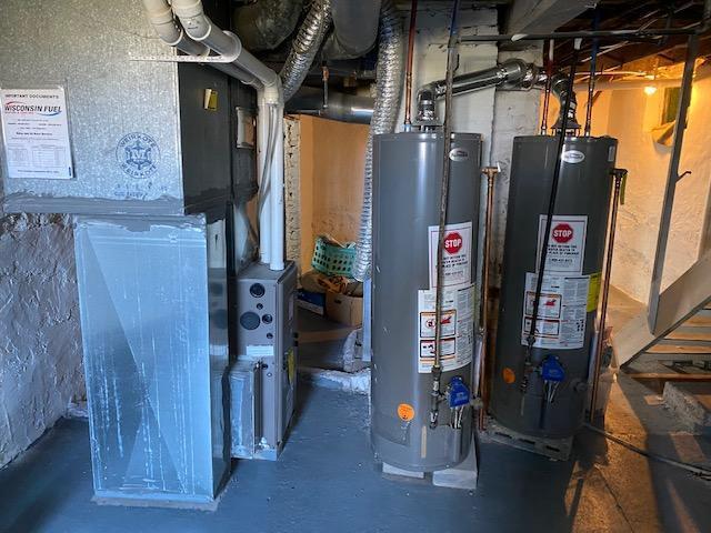 utilities featuring water heater and heating unit