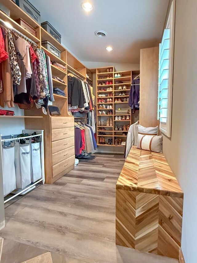 walk in closet featuring visible vents and light wood finished floors