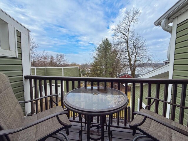wooden deck featuring outdoor dining space