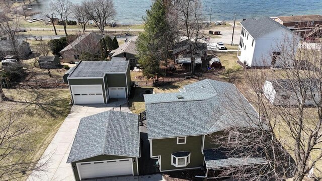 birds eye view of property with a water view