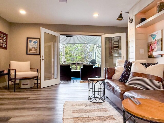 living area with recessed lighting and wood finished floors