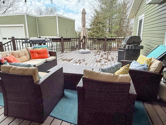 wooden deck featuring grilling area and outdoor lounge area
