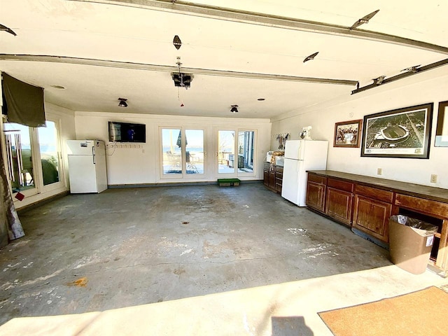 W4862 Swan Acre Dr, Cecil, WI 54111 - garage featuring freestanding refrigerator and french doors