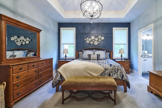 2721 Woodfield Ct, Howard, WI 54313 - carpeted bedroom with an inviting chandelier, a tray ceiling, and multiple windows