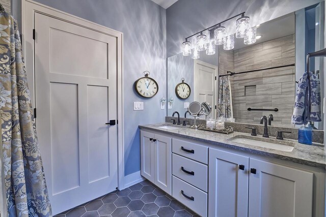 2721 Woodfield Ct, Howard, WI 54313 - full bath featuring tile patterned flooring, a sink, double vanity, and a shower with shower curtain