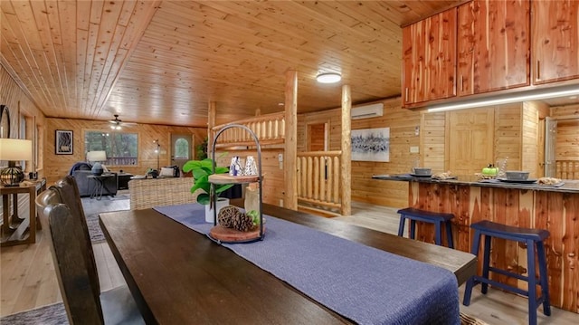 E19535 County Road Nd, Augusta, WI 54722 - dining space with light wood-type flooring, wooden walls, wooden ceiling, and a ceiling fan