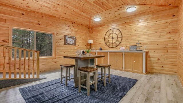 E19535 County Road Nd, Augusta, WI 54722 - dining space featuring lofted ceiling, wooden walls, wooden ceiling, and light wood finished floors
