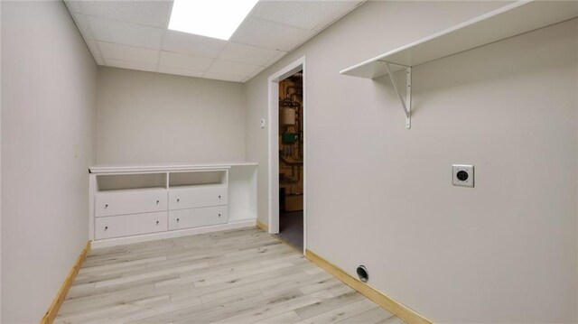 E19535 County Road Nd, Augusta, WI 54722 - laundry area featuring baseboards, wood finished floors, laundry area, and electric dryer hookup