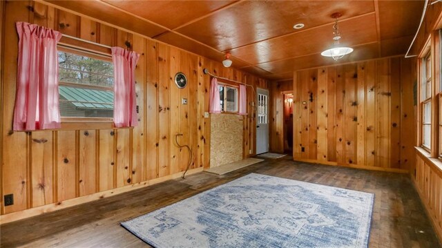 E19535 County Road Nd, Augusta, WI 54722 - empty room featuring baseboards, wood finished floors, wood walls, and wooden ceiling