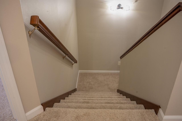 2208 W Milwaukee St, Stoughton, WI 53589 - staircase with baseboards and carpet