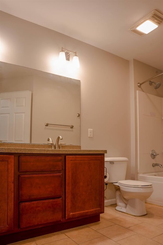 2208 W Milwaukee St, Stoughton, WI 53589 - full bathroom featuring visible vents, toilet, vanity, shower / washtub combination, and tile patterned flooring