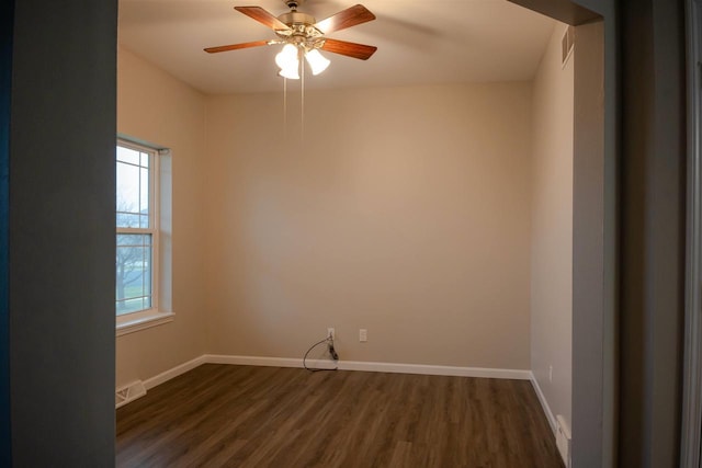 2208 W Milwaukee St, Stoughton, WI 53589 - unfurnished room featuring baseboards, visible vents, and dark wood-type flooring