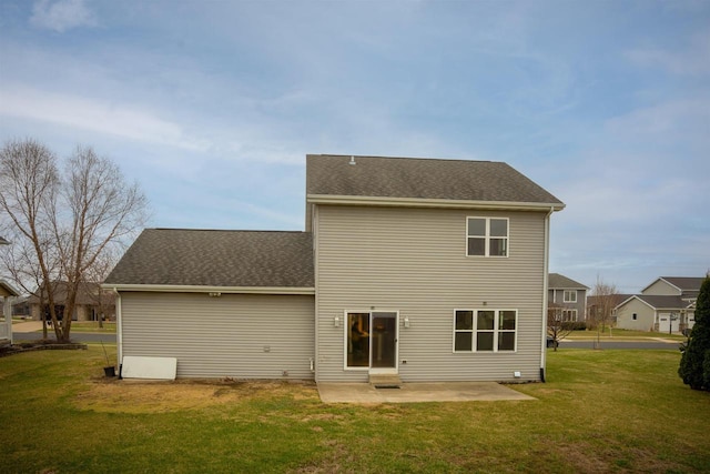 2208 W Milwaukee St, Stoughton, WI 53589 - back of house featuring a shingled roof, a yard, and a patio area