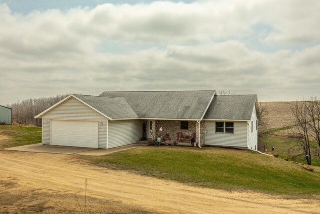 5995 Section Line Rd, Dodgeville, WI 53533 - single story home featuring a garage, a shingled roof, a front lawn, and dirt driveway