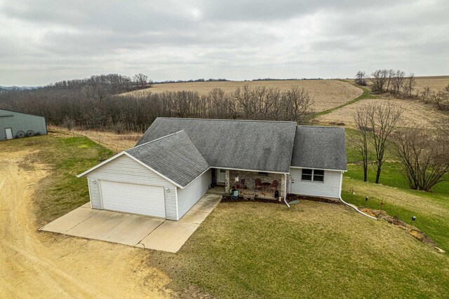 5995 Section Line Rd, Dodgeville, WI 53533 - view of front of property featuring roof with shingles, dirt driveway, a front lawn, a rural view, and a garage