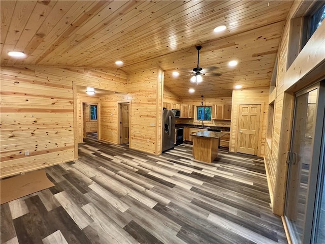 5830N Mutters Rd, Stone Lake, WI 54876 - kitchen featuring stainless steel fridge with ice dispenser, wood walls, dark countertops, and wood ceiling