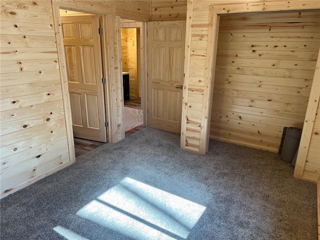 5830N Mutters Rd, Stone Lake, WI 54876 - unfurnished bedroom with wood walls and carpet