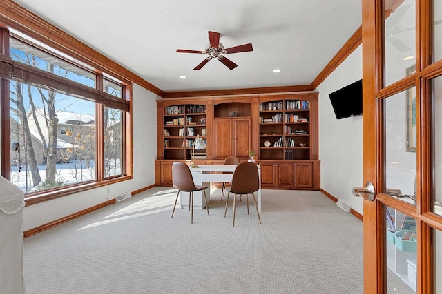 dining space with ornamental molding, visible vents, baseboards, and light carpet