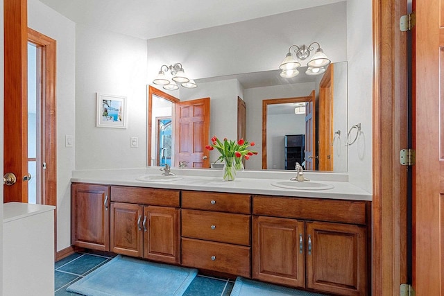 full bathroom featuring tile patterned flooring, double vanity, and a sink