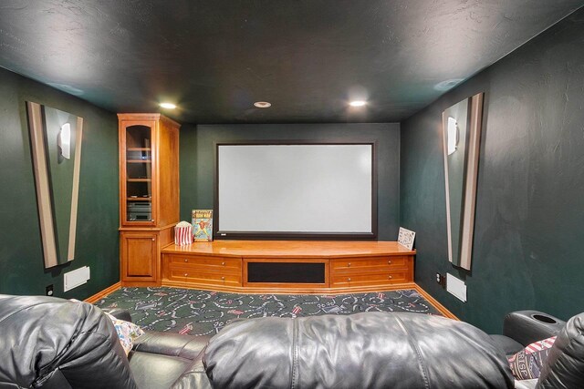cinema room featuring baseboards, recessed lighting, and carpet flooring